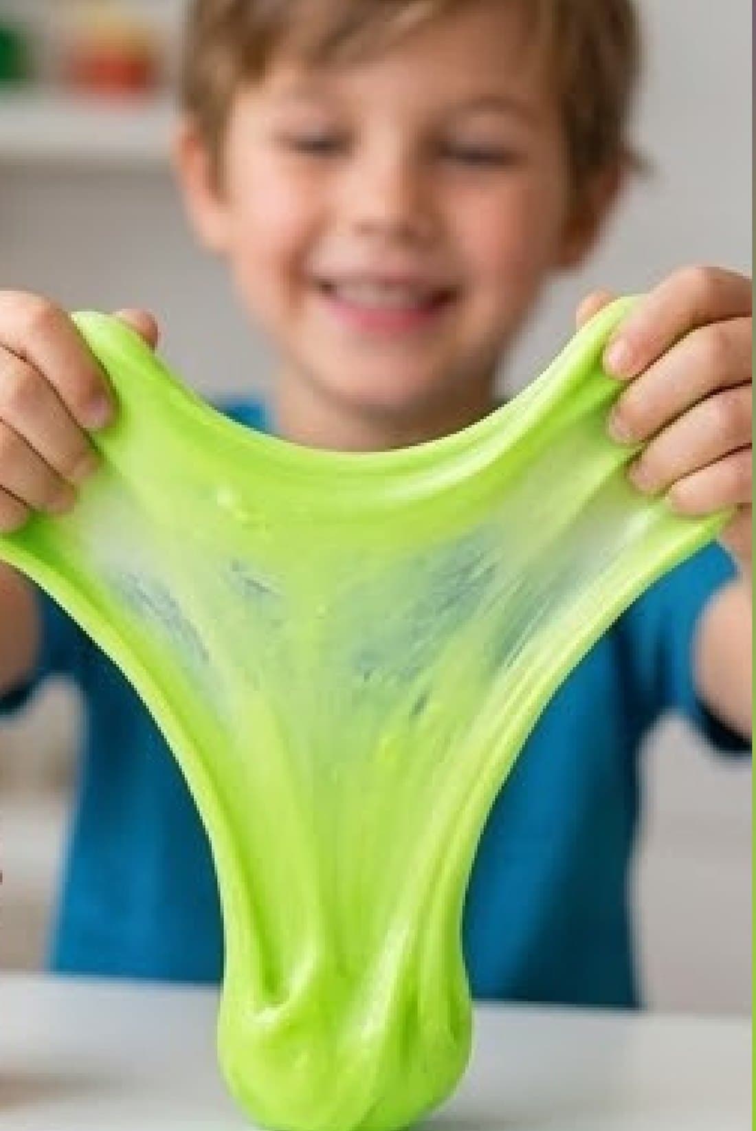 Child stretching bright green Strategix slime